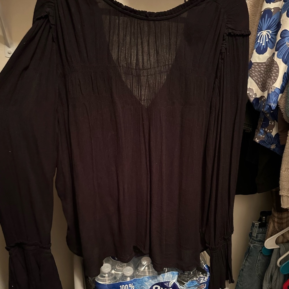 Black long sleeve dressy top will bell sleeves.